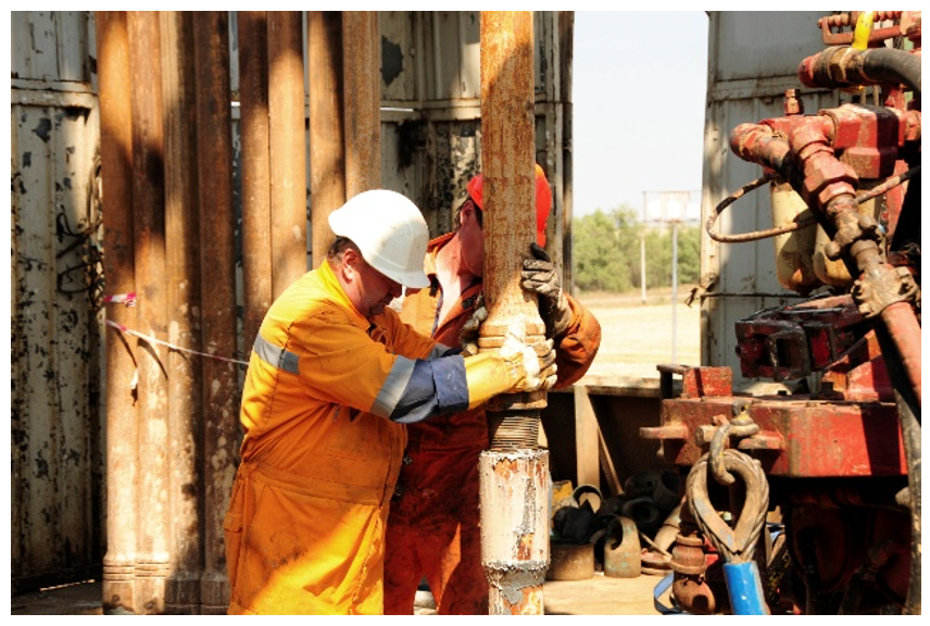 Worker performing maintenance in a confined space where H2S may be present